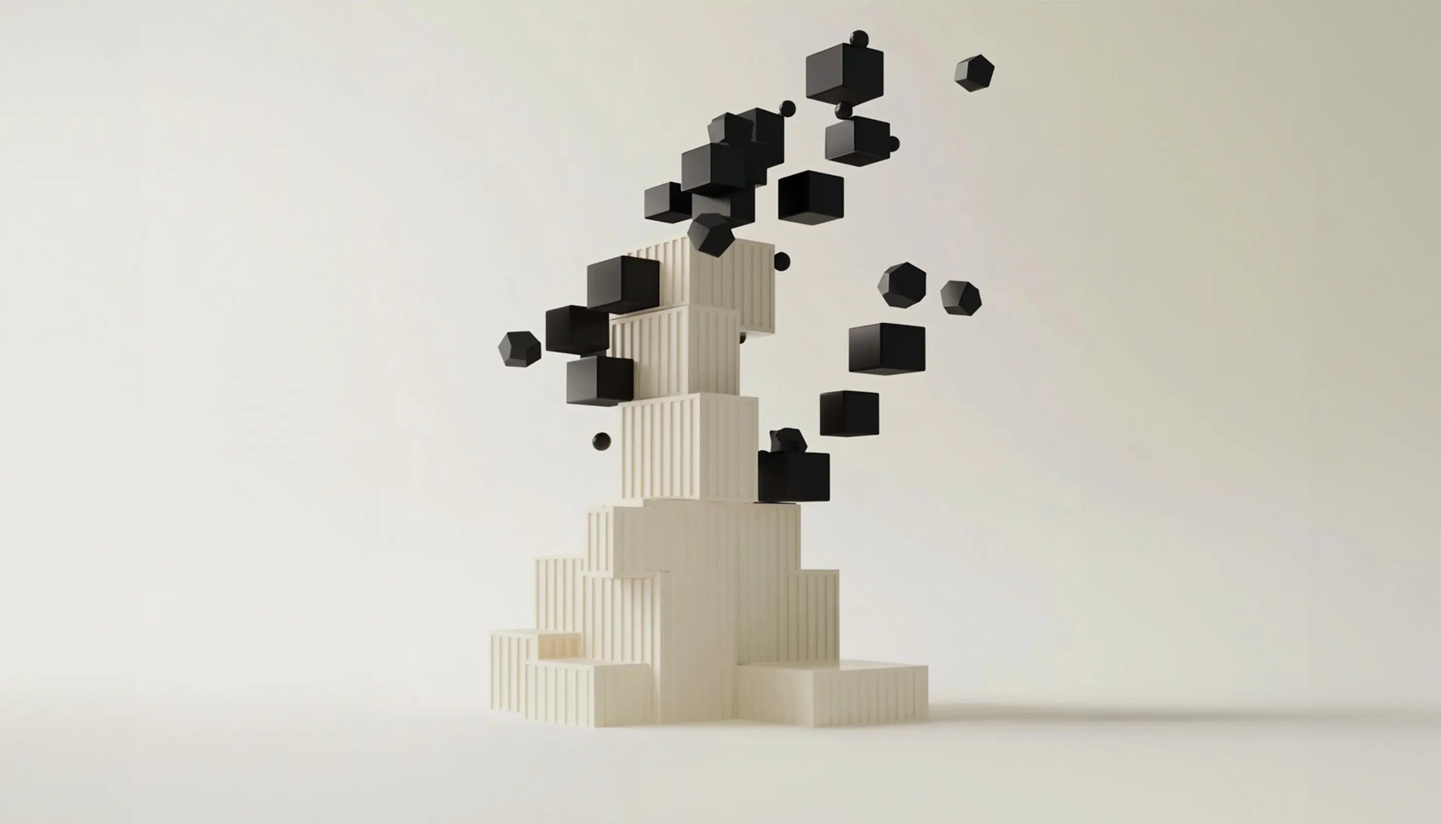White stacked rectangular blocks with black cubes and spheres floating above against a plain background.