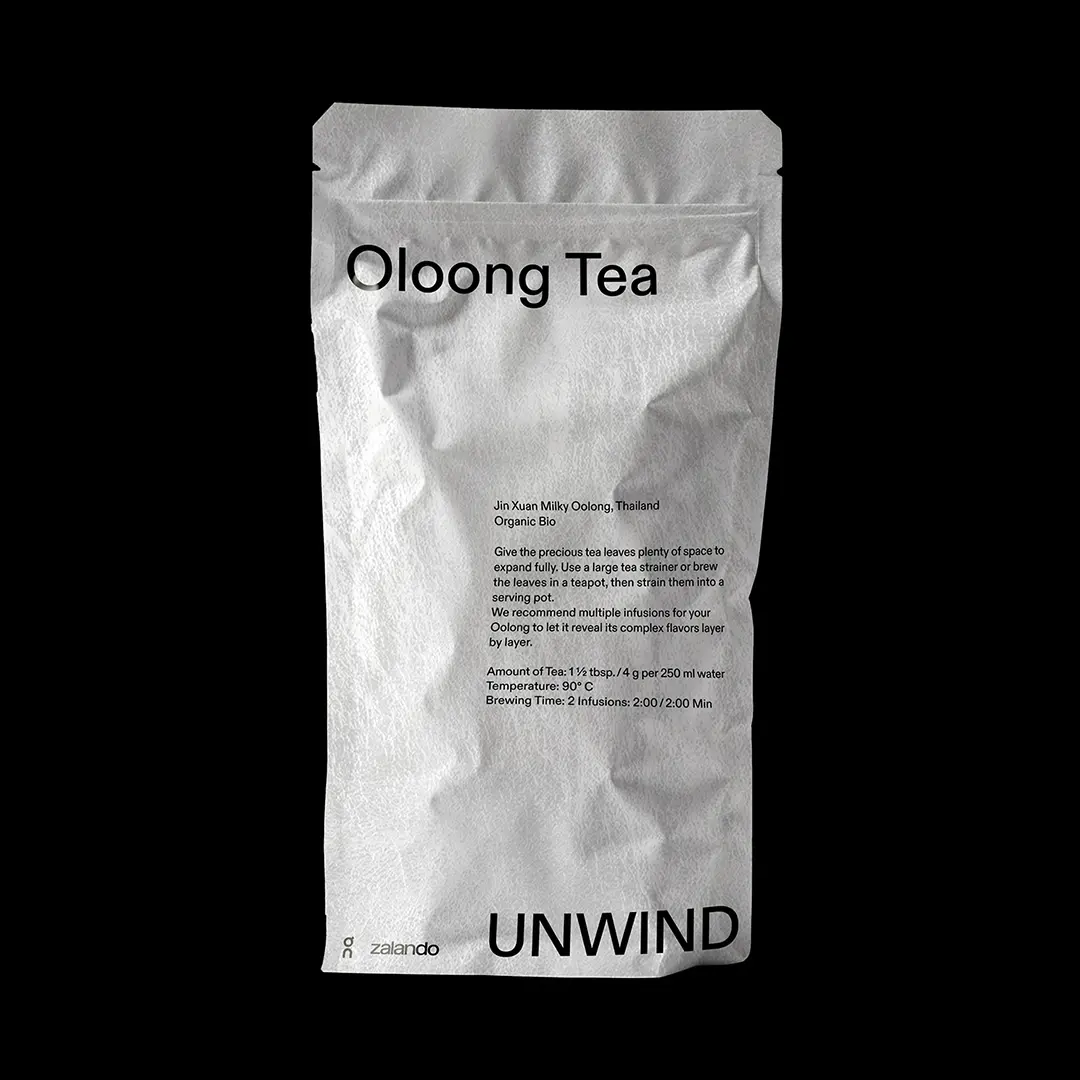 White package of Oolong Tea with brewing instructions and 'UNWIND' text on the front.